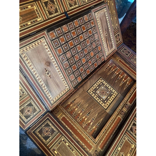 1718 - A 19th Century Moroccan inlaid games table with fitted interior