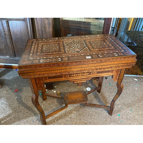 1718 - A 19th Century Moroccan inlaid games table with fitted interior