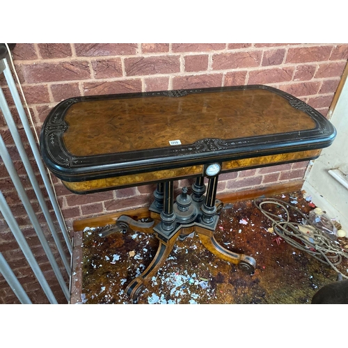 1719 - A Victorian walnut and inlaid ebony folding top card table with Wedgwood panel