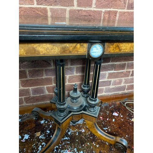 1719 - A Victorian walnut and inlaid ebony folding top card table with Wedgwood panel