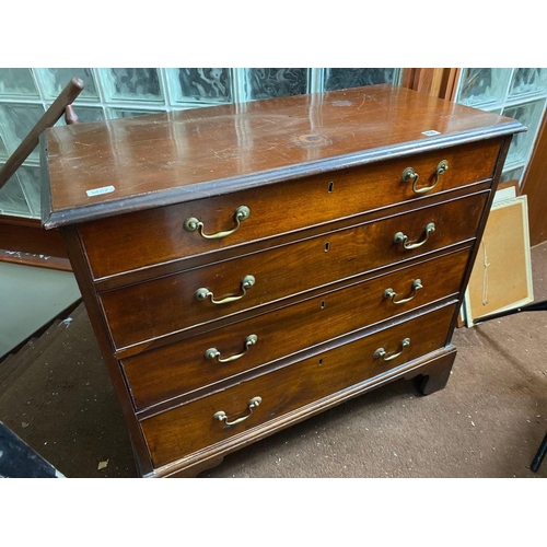 1730 - A small Georgian mahogany chest with four long graduated drawers, bracket feet