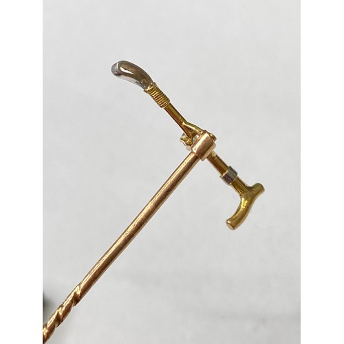 146 - A high carat gold and platinum diamond set riding crop Stick Pin