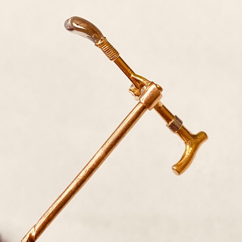 146 - A high carat gold and platinum diamond set riding crop Stick Pin