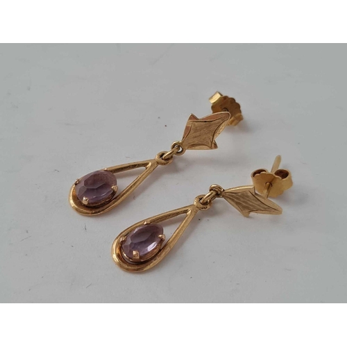 41 - A pair of amethyst set tear drop earrings 18ct gold 3.2g