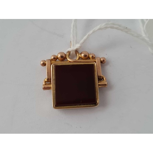 23 - An oblong spinning fob in 9ct