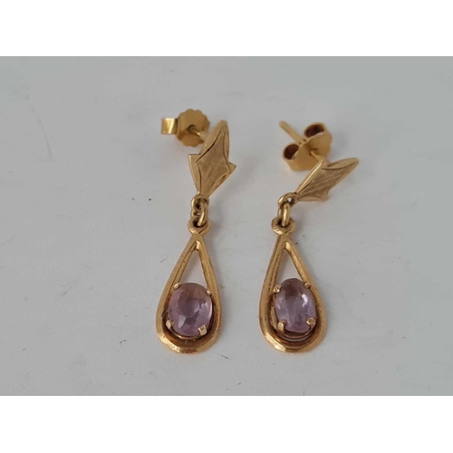 41 - A pair of amethyst set tear drop earrings 18ct gold 3.2g