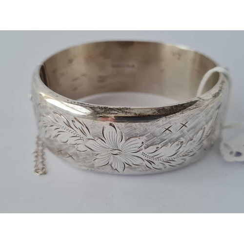 103 - A wide silver bangle    38 gms