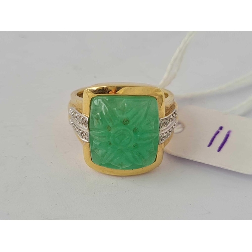 11 - A diamond and jade ring 14ct gold size N    7.8 gms