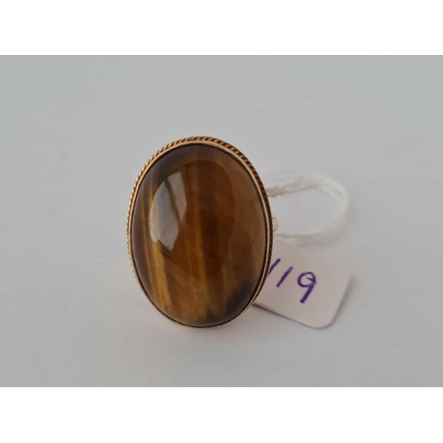 119 - A tigers eye ring 9ct  size T    9.5 gms