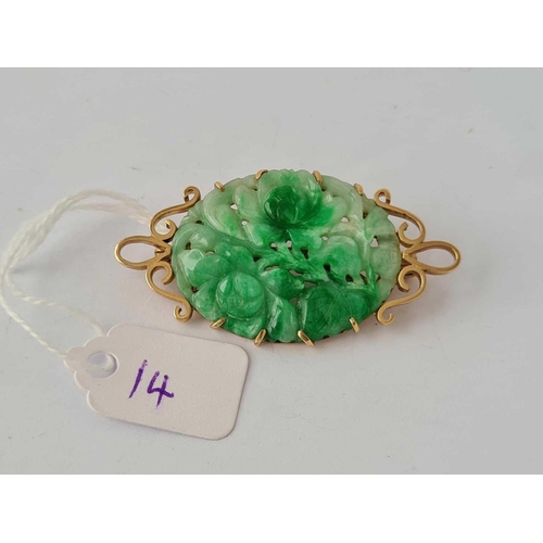 14 - A CARVED JADE BROOCH 9CT