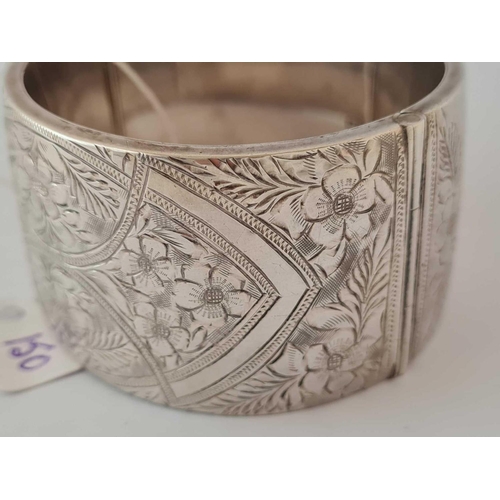 150 - A very wide silver bangle    65 gms