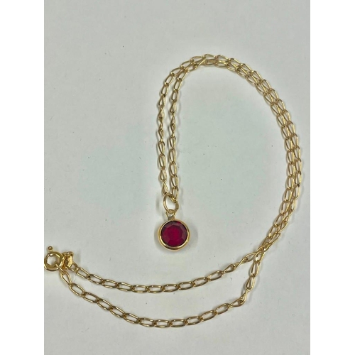 155 - A red stone pendant on 9ct chain 16 inch    3 gms