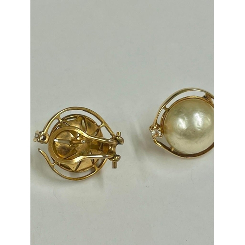 159 - A pair of yellow metal MABE pearl and stone set clip on earrings