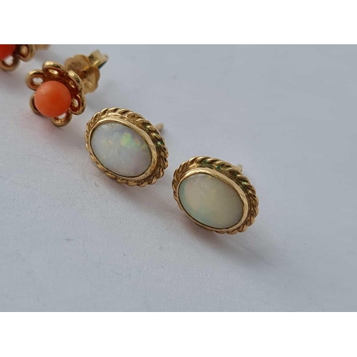 166 - A pair of gold and opal earrings and a pair of gold & coral studs