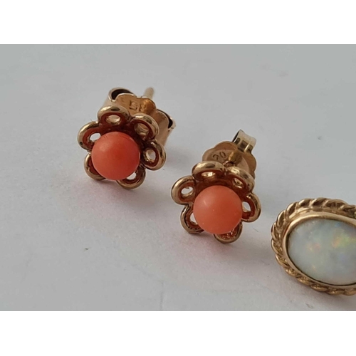 166 - A pair of gold and opal earrings and a pair of gold & coral studs