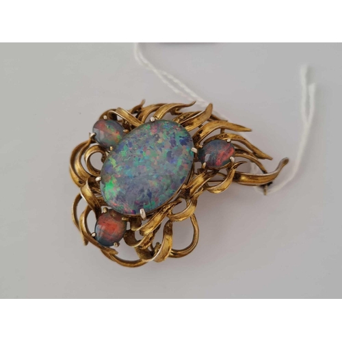 181 - A silver gilt brooch with opal doublets