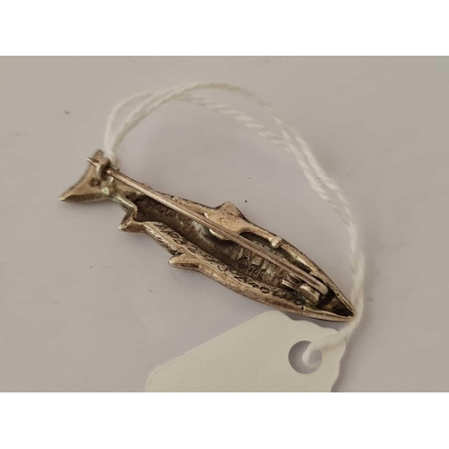 183 - A silver brooch in the form of a fish