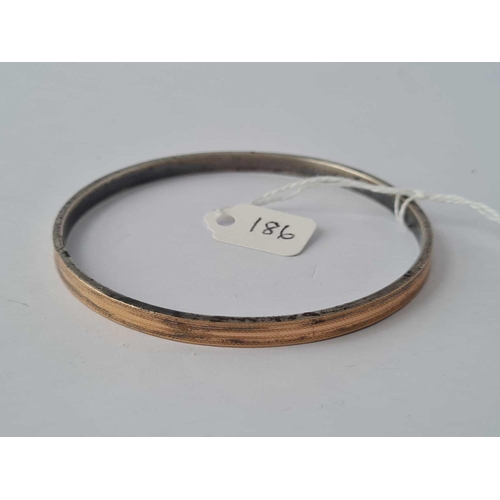 186 - A silver and gold bangle    27 gms