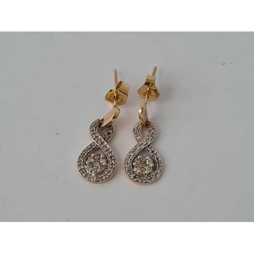 195 - A pair of 9ct diamond drop earrings