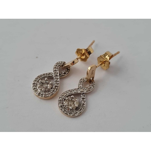 195 - A pair of 9ct diamond drop earrings