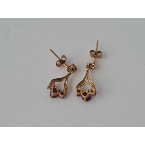 197 - A pair of ruby 9ct earrings