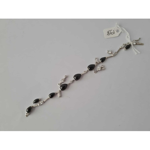 198 - A black and white stone set silver bracelet 17.5g inc