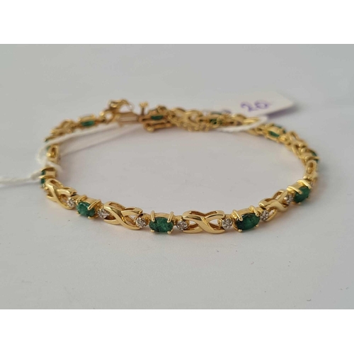 20 - A 14CT GOLD DIAMOND AND EMERALD BRACELET      10.7 GMS