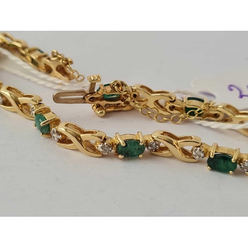 20 - A 14CT GOLD DIAMOND AND EMERALD BRACELET      10.7 GMS