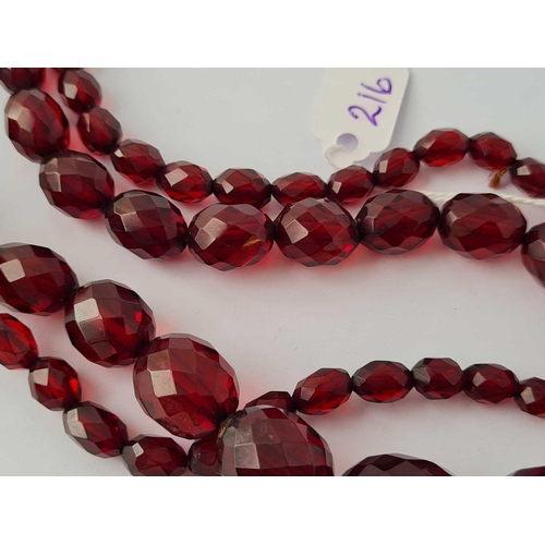 216 - A string of cherry amber beads     53.5 gms