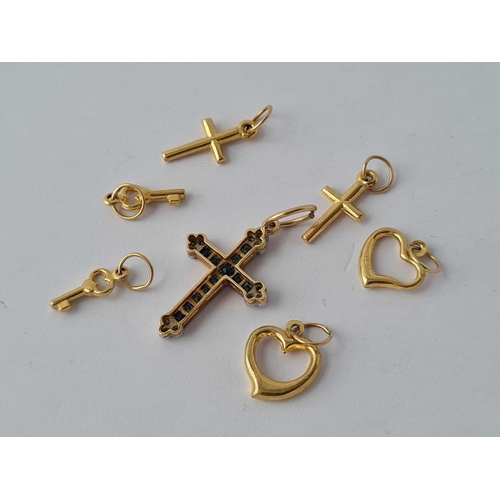 225 - Assorted charms and a cross 9ct   3.5 gms