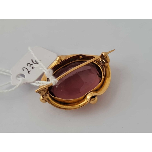 236 - A Victorian gem set oval brooch with large amethyst stone in high carat gold     9.3 gms