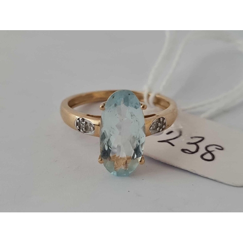 238 - A aquamarine oval centre stone ring with diamond shoulders 10ct gold  size O      2.2 gms