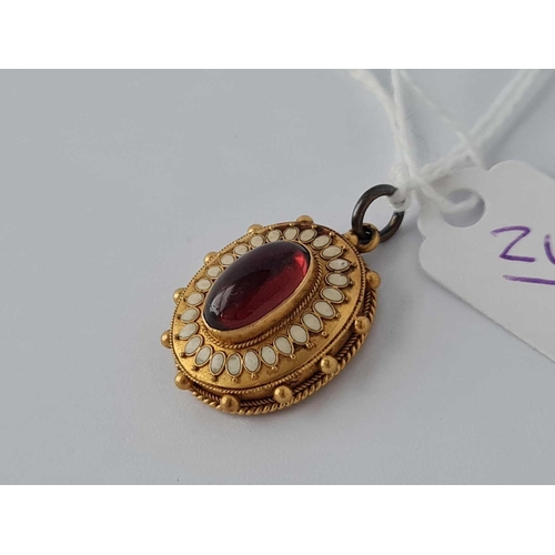 243 - A garnet and emerald locket pendant 15ct gold    4.3 gms