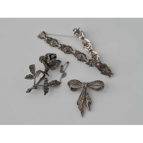 245 - Two silver marcasite brooches and bracelet