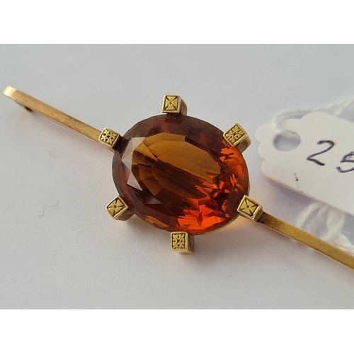 25 - Antique 9ct stamped bar brooch set with a citrine, length 62mm