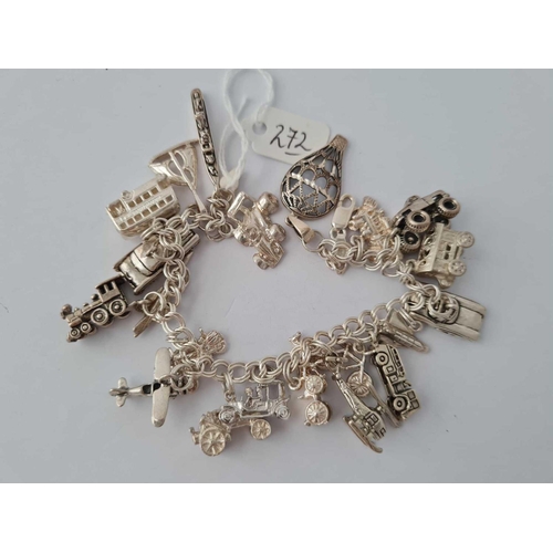 272 - Another silver charm bracelet with 21   �Age of travel� charms 65g