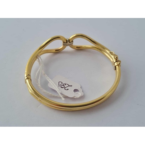 280 - A LADIES HINGED 14CT GOLD BANGLE 14.9g