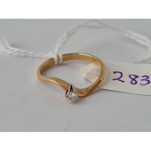 283 - A solitaire diamond  ring with design twist shank 18ct gold size N    2.1 gms