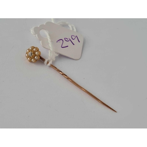 299 - A pearl and diamond stick pin 15ct gold