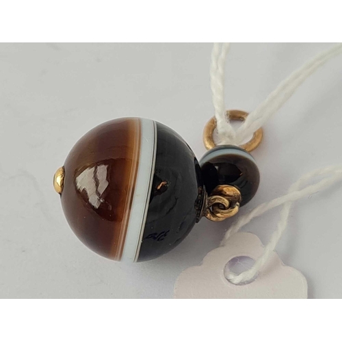 320 - A onyx and diamond pendant