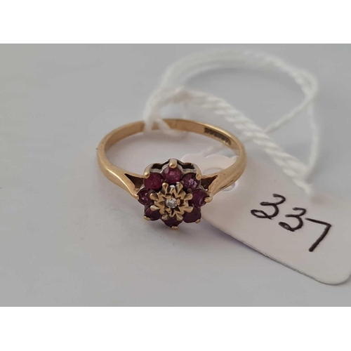 337 - A ruby and diamond ring 9ct size K