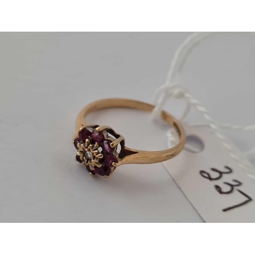 337 - A ruby and diamond ring 9ct size K