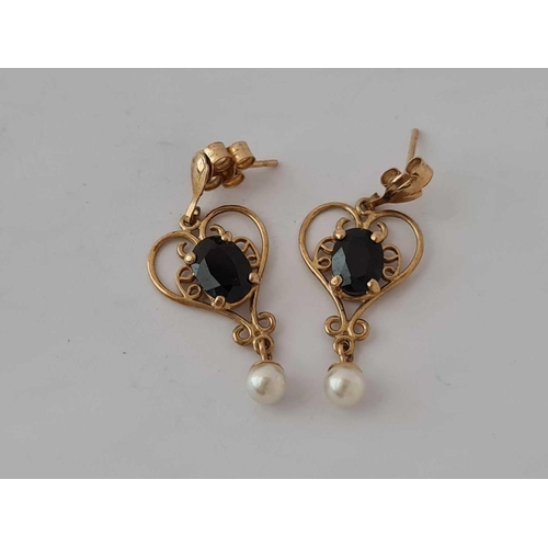 339 - A pair of garnet earrings with suspended pearls 9ct   1.9 gms