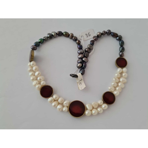 35 - A fancy black and white pearl necklace