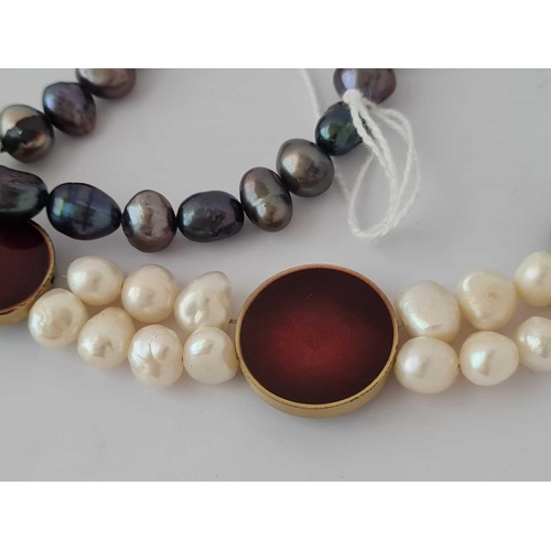 35 - A fancy black and white pearl necklace