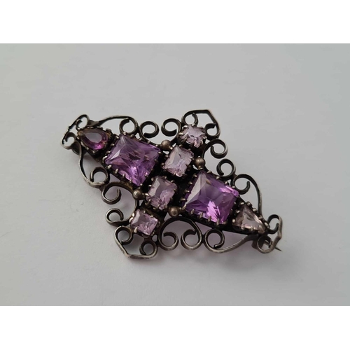 351 - Two arts and crafts silver and amethyst brooches