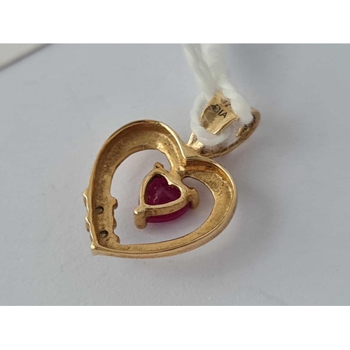 357 - A heart shaped pendant with ruby and diamonds 9ct