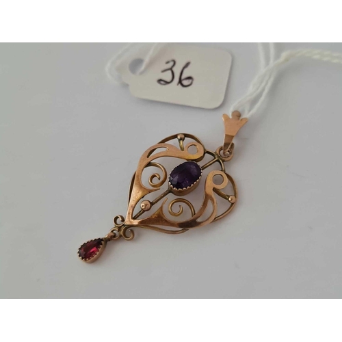 36 - A pretty heart shaped and scrolled art nouveau amethyst and pink garnet pendant 9ct