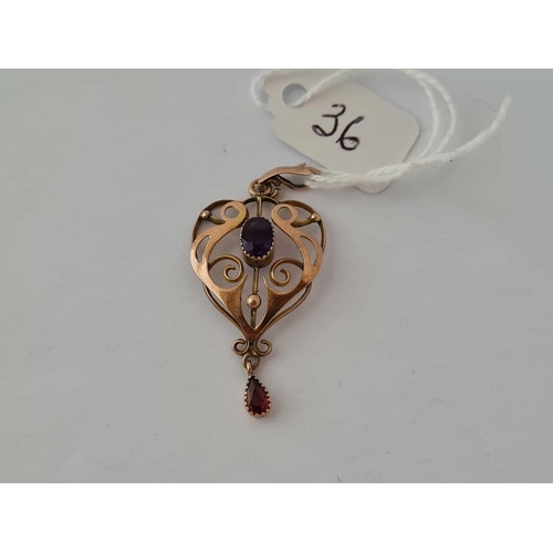 36 - A pretty heart shaped and scrolled art nouveau amethyst and pink garnet pendant 9ct