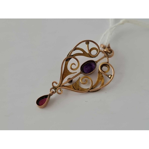 36 - A pretty heart shaped and scrolled art nouveau amethyst and pink garnet pendant 9ct